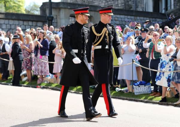 Prince Harry (left) walks with his best man, the Duke of Cambridge, as he arrives at St George's Chapel at Windsor Castle. PIC: PA