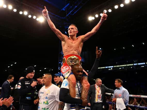 Josh Warrington celebrates becoming Leeds' first boxing world champion