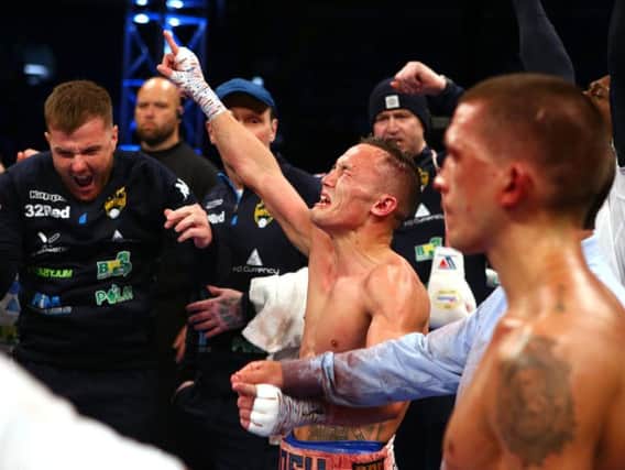 Josh Warrington celebrates as a split decision over Lee Selby goes his way.