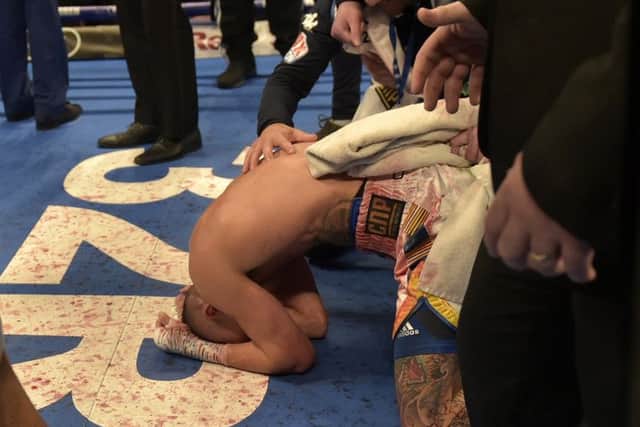 Josh Warrington sinks to his knees after being Lee Selby on points last night at Elland Roa.