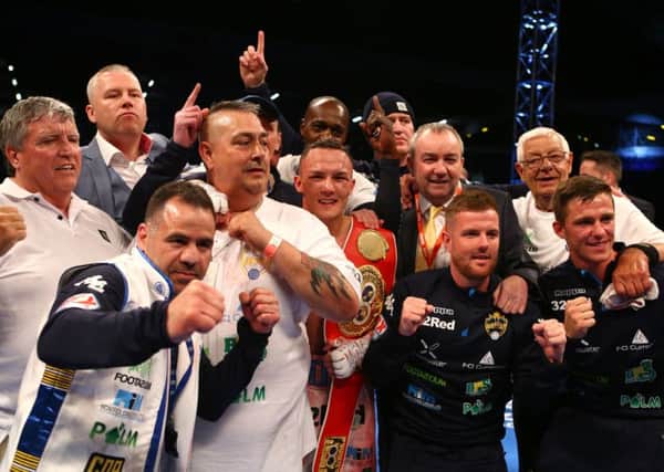 Josh Warrington and his team celebrate after the fight last night.