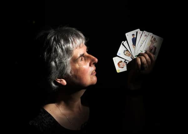 Classic Board Game Collection at the Leeds Discovery Centre.Curator of Leeds History Kitty Ross, looks at a pack of Striptease playing cards dated 1937...21st May 2018 ..Picture by Simon Hulme