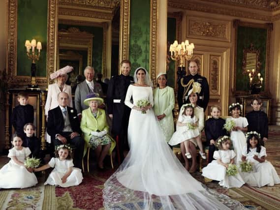 This official wedding photograph released by the Duke and Duchess of Sussex shows The Duke and Duchess in The Green Drawing Room, Windsor Castle, with (left-to-right): Back row: Master Jasper Dyer, the Duchess of Cornwall, the Prince of Wales, Ms. Doria Ragland, The Duke of Cambridge; middle row: Master Brian Mulroney, the Duke of Edinburgh, Queen Elizabeth II, the Duchess of Cambridge, Princess Charlotte, Prince George, Miss Rylan Litt, Master John Mulroney; Front row: Miss Ivy Mulroney, Miss Florence van Cutsem, Miss Zalie Warren, Miss Remi Litt. Photo: Alexi Lubomirski/PA Wire