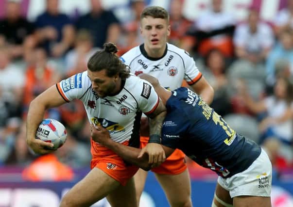 Castleford Tigers' Alex Foster is tackled by Leeds Rhinos' Jamie Jones-Buchanan during the Betfred Super League, Magic Weekend. PIC: Richard Sellers/PA Wire