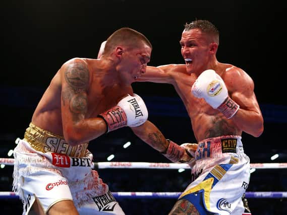 WORLD BEATER: Josh Warrington on his way to victory against Lee Selby at Elland Road on Saturday night. Picture: PA.