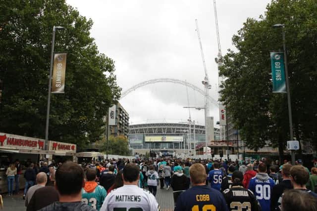 NFL UK fans make their way to Wembley Stadium.