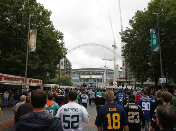 NFL UK fans make their way to Wembley Stadium.