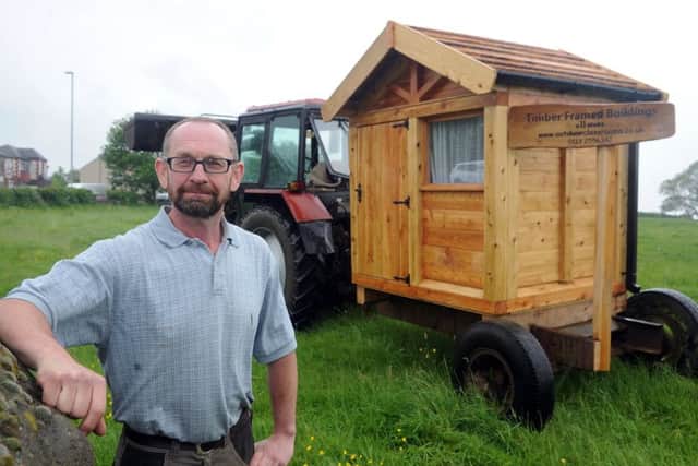25 May 2018 .......      Carpenter Richard Kirby with one of his sheds on Rodley roundabout, which has fallen foul of council planning laws... causing him to receive a warning/threats of fines etc... He has agreed to move said shed and donate it to a local school. Picture Tony Johnson.
