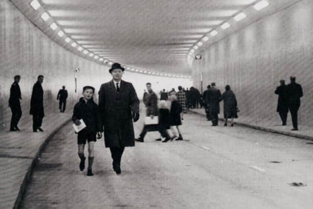 Pedestrians stretch their legs on part of the Leeds inner ring road before its opening.
