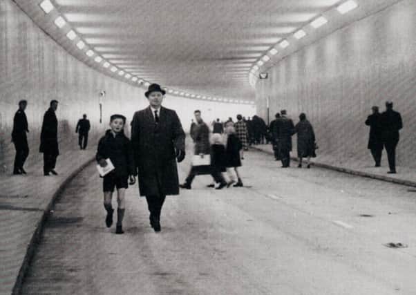Pedestrians stretch their legs on part of the Leeds inner ring road before its opening.