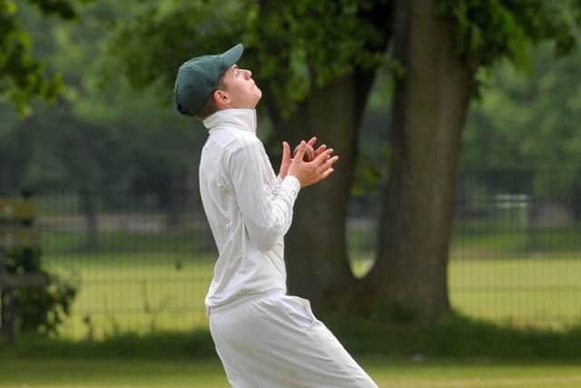 Elliot Audsey, of Adel, takes a catch after
North Leeds batsman Taran Chana played the ball into the air. PIC: Steve Riding