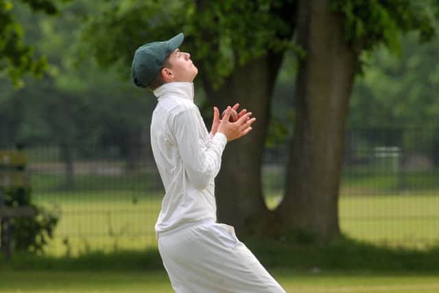 Elliot Audsey, of Adel, takes a catch after 
North Leeds batsman Taran Chana played the ball into the air. PIC: Steve Riding