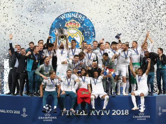 Real Madrid lift the 2018 Champions League trophy.