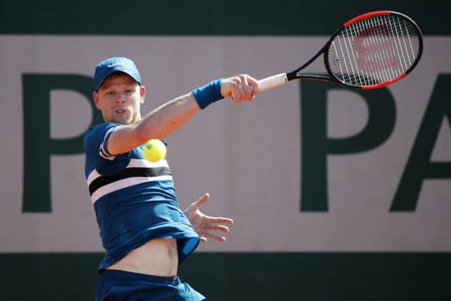 UP AND RUNNING: Yorkshire's Kyle Edmund hits a return to Australia's Alex de Minaur during their first round match at the French Open. Picture: AP/Christophe Ena.