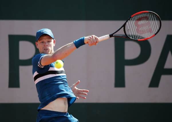 UP AND RUNNING: Yorkshire's Kyle Edmund hits a return to Australia's Alex de Minaur during their first round match at the French Open. Picture: AP/Christophe Ena.