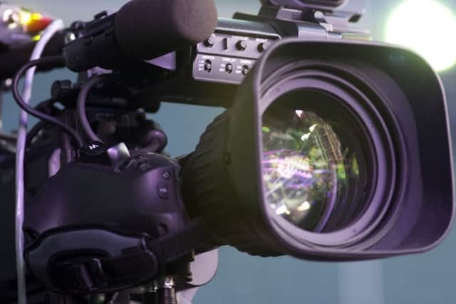 Professional digital video camera. accessories for 4k video cameras. tv camera in a concert hall